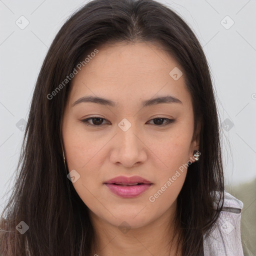 Joyful asian young-adult female with long  brown hair and brown eyes