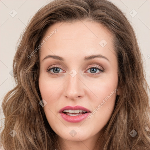 Joyful white young-adult female with long  brown hair and blue eyes