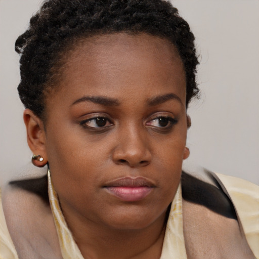 Neutral black young-adult female with short  brown hair and brown eyes