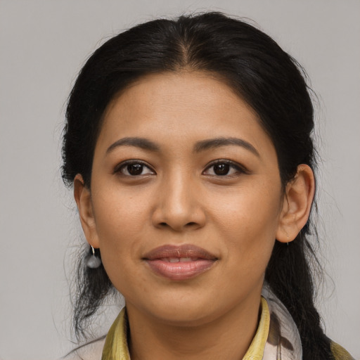 Joyful asian young-adult female with medium  brown hair and brown eyes