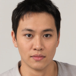 Neutral asian young-adult male with short  brown hair and brown eyes