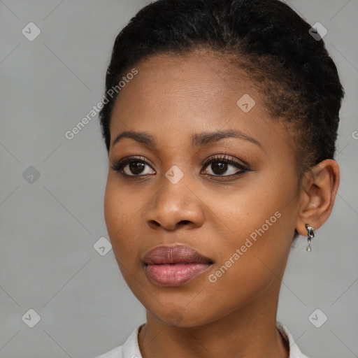 Joyful black young-adult female with short  brown hair and brown eyes