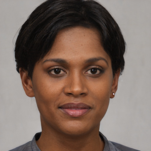 Joyful asian young-adult female with short  brown hair and brown eyes