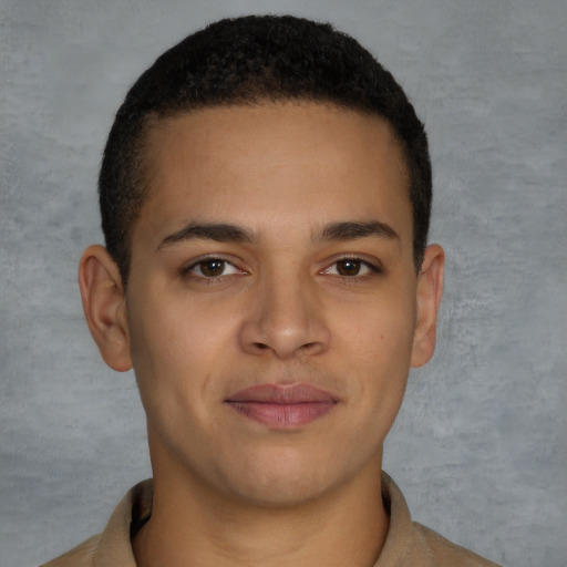 Joyful latino young-adult male with short  brown hair and brown eyes