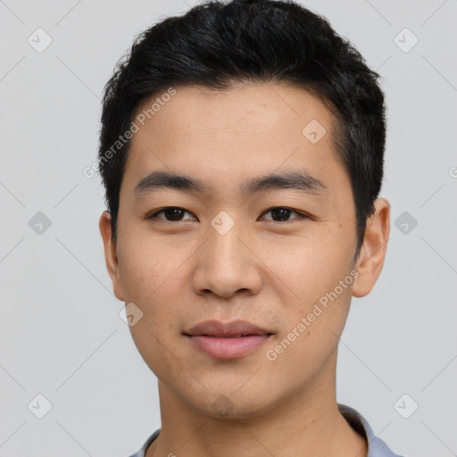 Joyful asian young-adult male with short  black hair and brown eyes