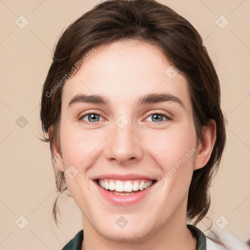 Joyful white young-adult female with medium  brown hair and green eyes