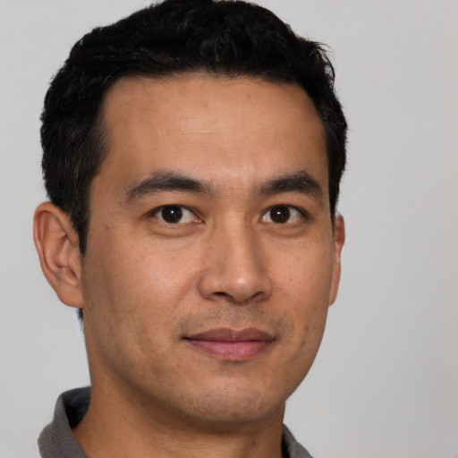 Neutral latino young-adult male with short  brown hair and brown eyes