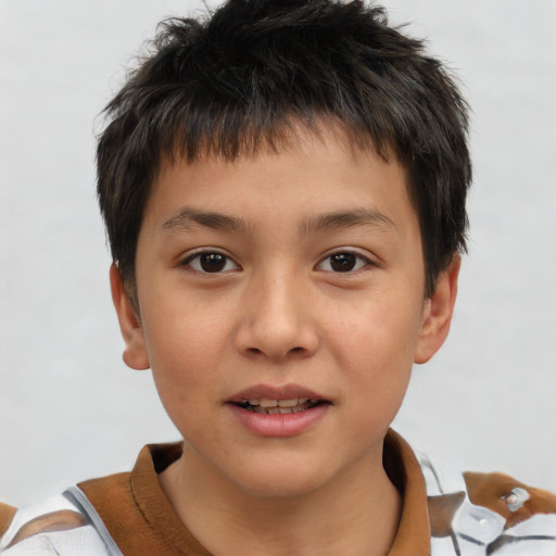 Joyful white child male with short  brown hair and brown eyes
