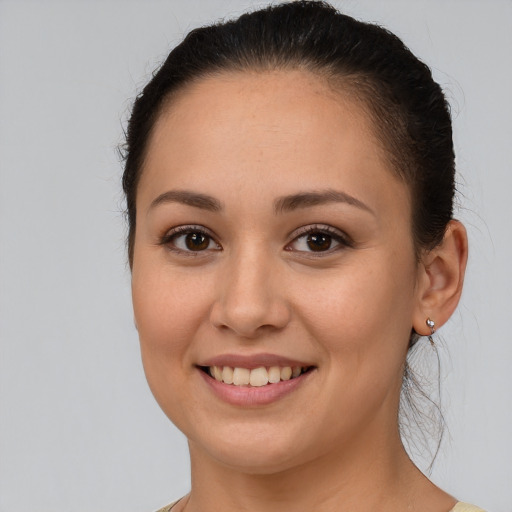 Joyful white young-adult female with medium  brown hair and brown eyes