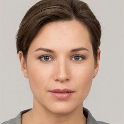 Neutral white young-adult female with short  brown hair and brown eyes