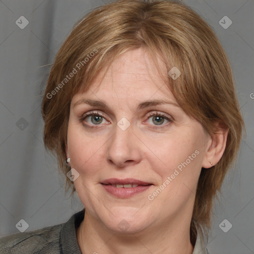 Joyful white adult female with medium  brown hair and grey eyes