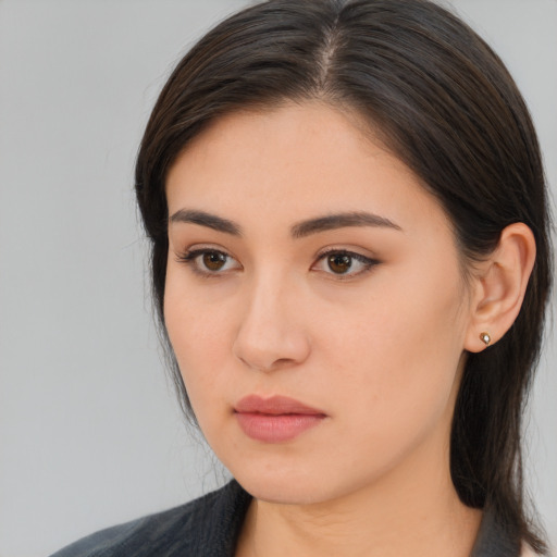 Neutral white young-adult female with long  brown hair and brown eyes