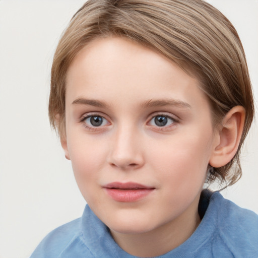 Joyful white child female with short  brown hair and grey eyes