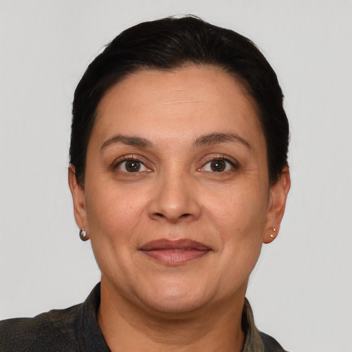 Joyful white adult female with short  brown hair and brown eyes