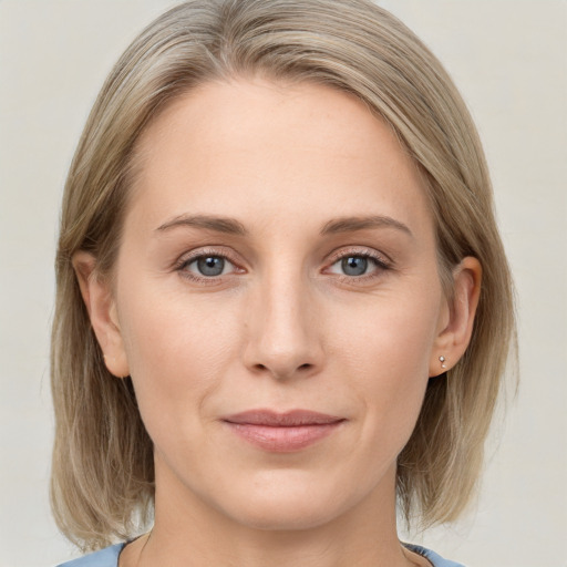 Joyful white young-adult female with medium  brown hair and blue eyes