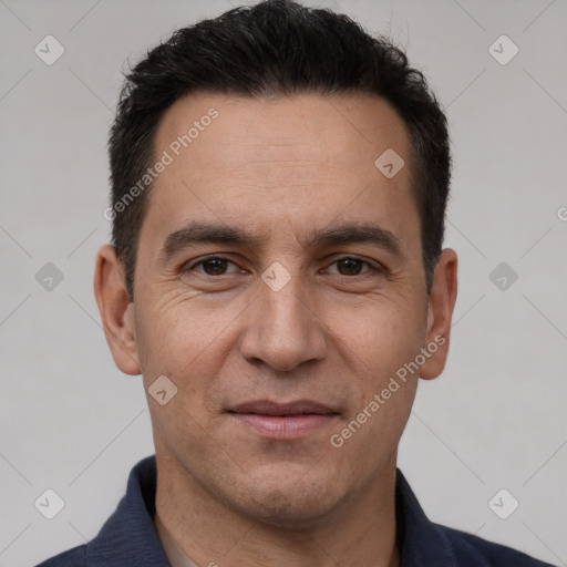 Joyful white adult male with short  brown hair and brown eyes