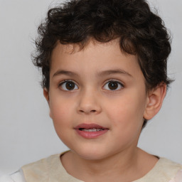 Joyful white child male with short  brown hair and brown eyes