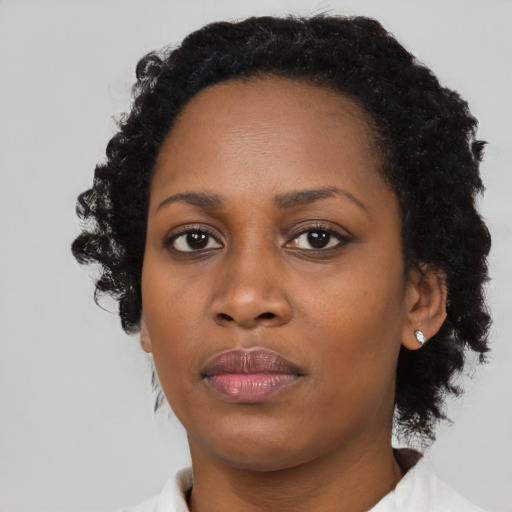 Neutral black young-adult female with medium  black hair and brown eyes