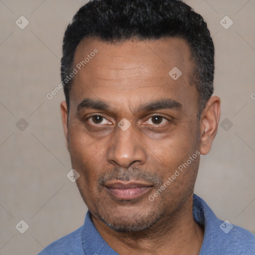 Joyful latino adult male with short  black hair and brown eyes