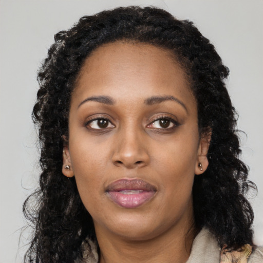 Neutral black young-adult female with long  black hair and brown eyes