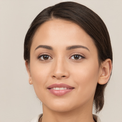 Joyful white young-adult female with medium  brown hair and brown eyes