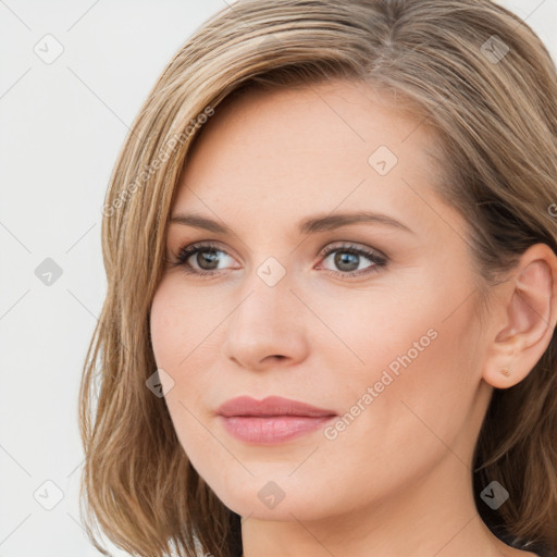 Joyful white young-adult female with long  brown hair and blue eyes