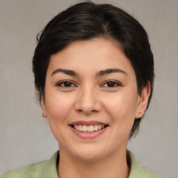 Joyful asian young-adult female with medium  brown hair and brown eyes