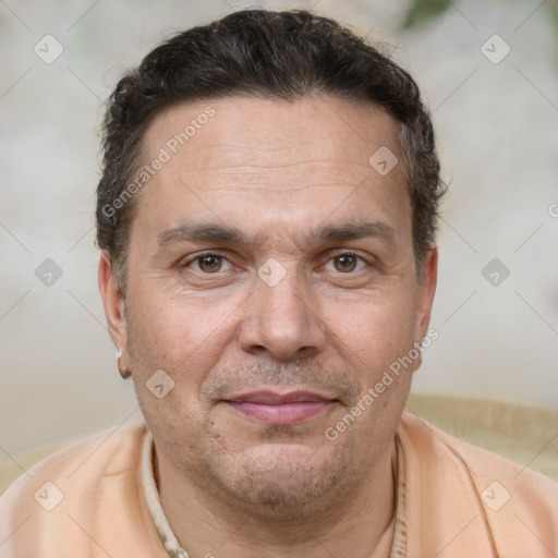 Joyful white adult male with short  brown hair and brown eyes