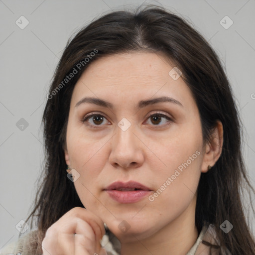 Joyful white adult female with medium  brown hair and brown eyes