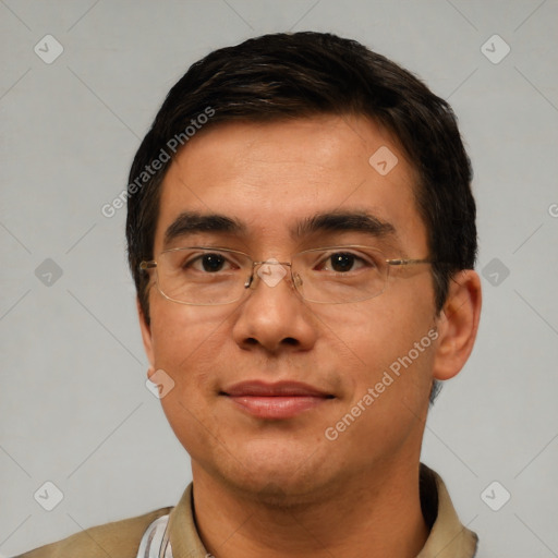 Joyful white adult male with short  black hair and brown eyes
