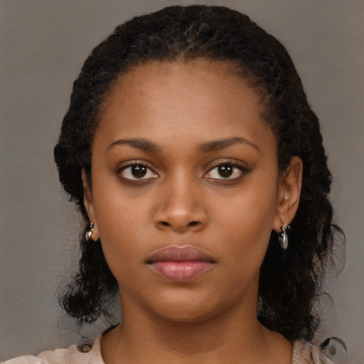 Neutral black young-adult female with long  black hair and brown eyes