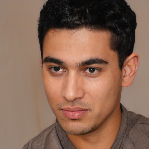 Neutral white young-adult male with short  black hair and brown eyes