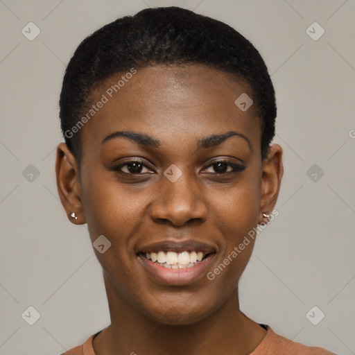 Joyful black young-adult female with short  black hair and brown eyes