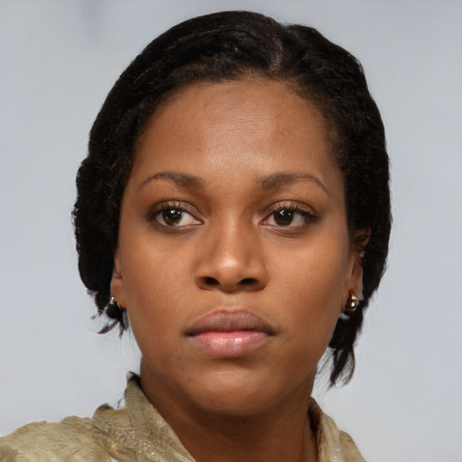 Neutral black young-adult female with medium  brown hair and brown eyes