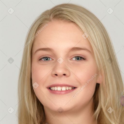 Joyful white young-adult female with long  brown hair and blue eyes