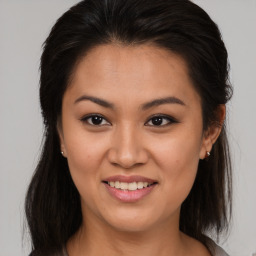 Joyful asian young-adult female with medium  brown hair and brown eyes