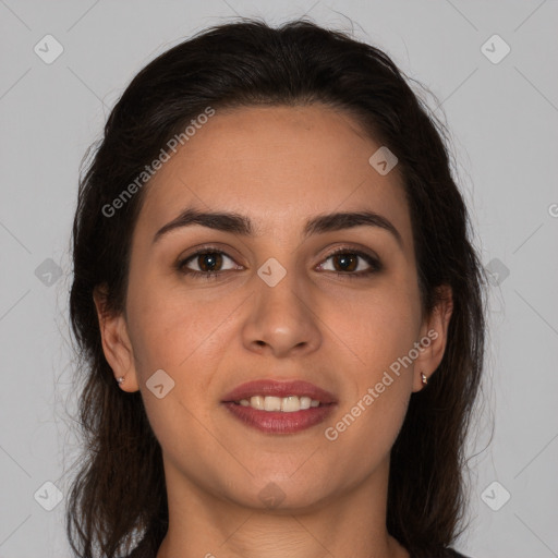 Joyful white young-adult female with long  brown hair and brown eyes