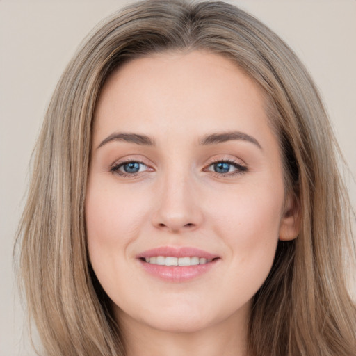 Joyful white young-adult female with long  brown hair and grey eyes