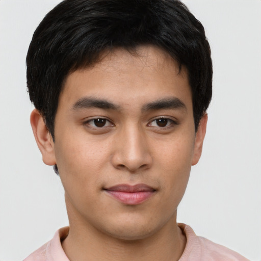Joyful asian young-adult male with short  brown hair and brown eyes