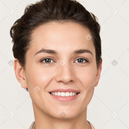 Joyful white young-adult female with short  brown hair and grey eyes