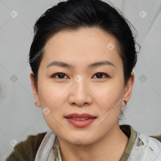 Joyful asian young-adult female with short  brown hair and brown eyes