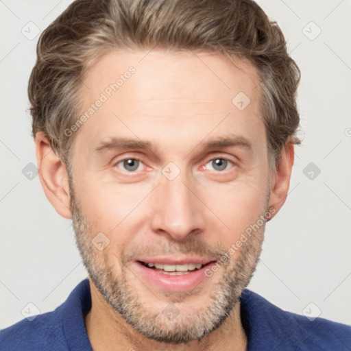 Joyful white adult male with short  brown hair and grey eyes