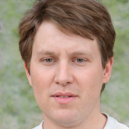 Joyful white adult male with short  brown hair and grey eyes