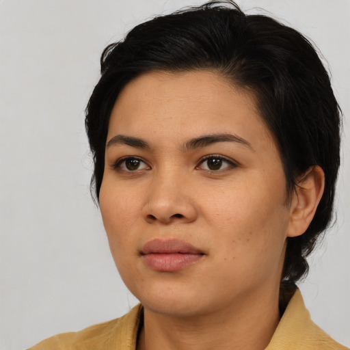 Neutral asian young-adult female with medium  brown hair and brown eyes