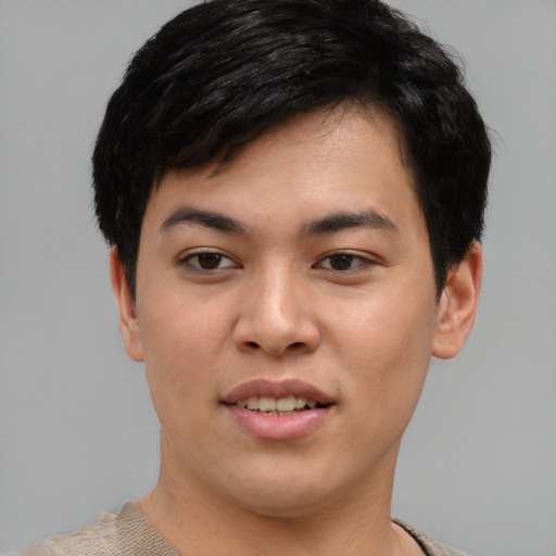Joyful asian young-adult male with short  black hair and brown eyes