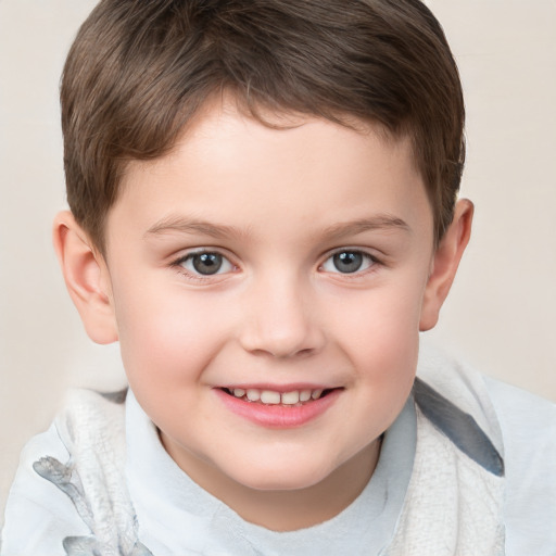 Joyful white child male with short  brown hair and brown eyes