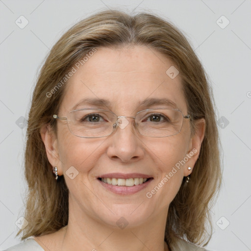 Joyful white adult female with medium  brown hair and brown eyes