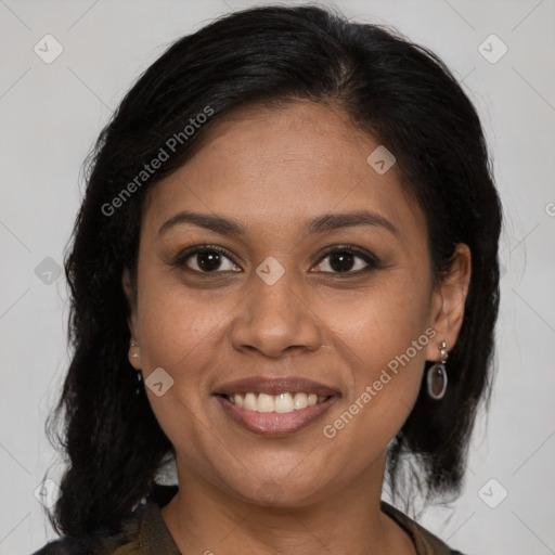 Joyful black adult female with medium  brown hair and brown eyes