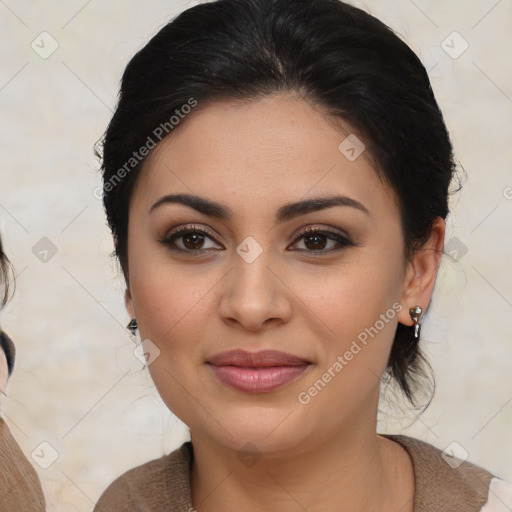 Joyful latino young-adult female with medium  brown hair and brown eyes