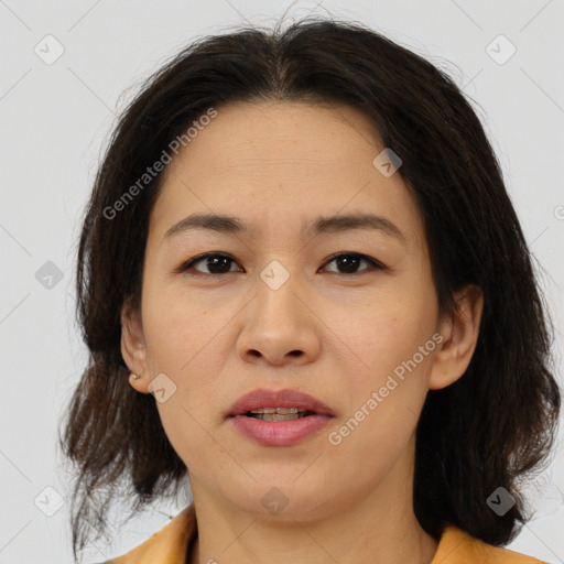 Joyful white adult female with medium  brown hair and brown eyes